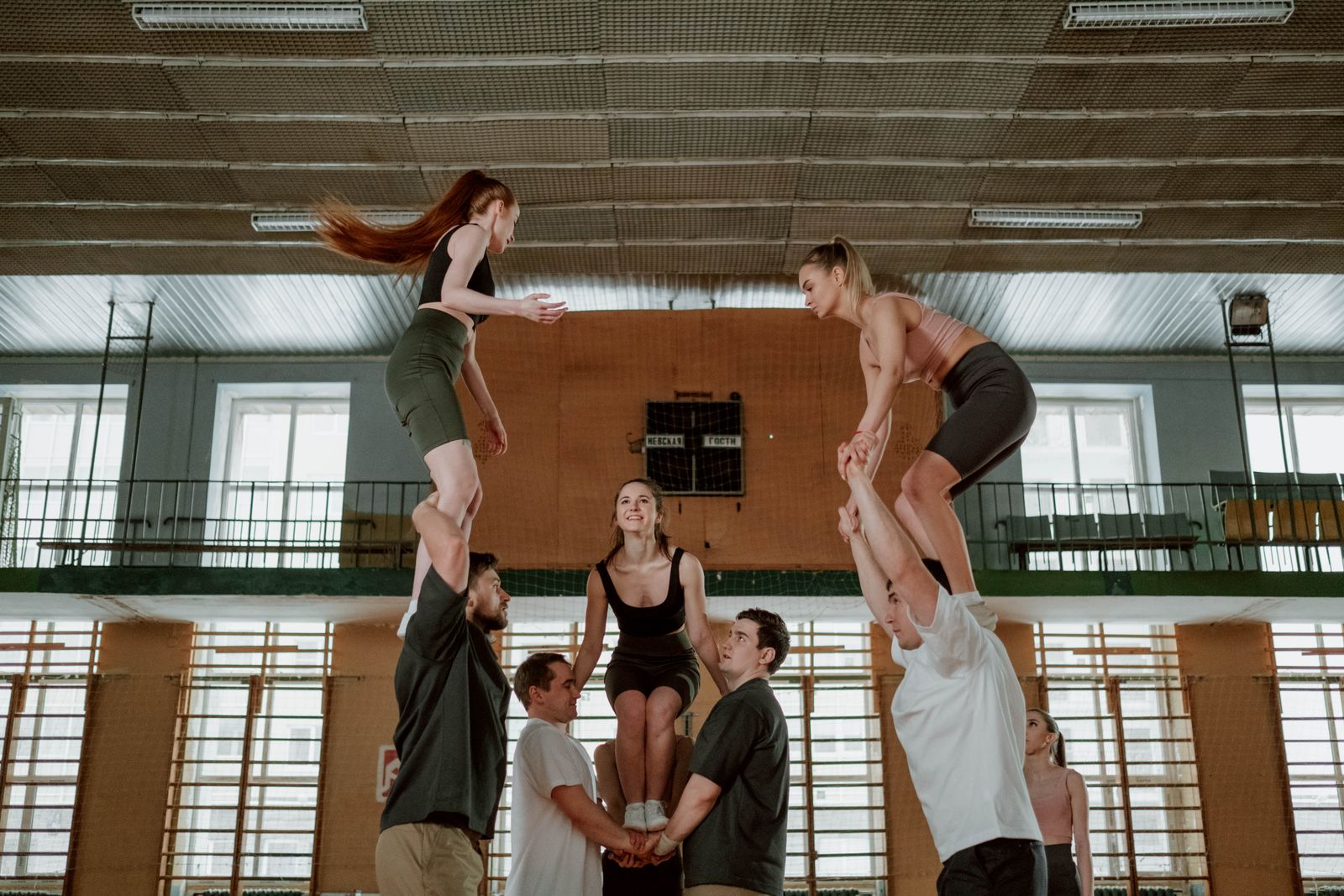 Stock photo: A group practising a supported acrobatic lift